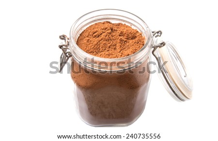 Instant chocolate drink powder in glass jar container over white background 