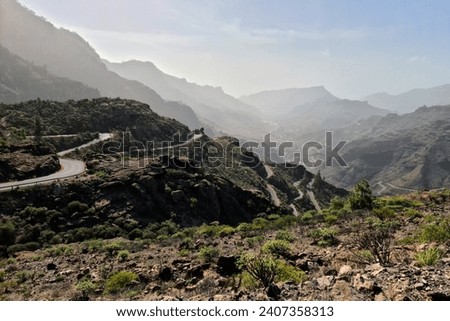 Road GC-605 in Gran Canaria mountain road with many hairpin turns. Royalty-Free Stock Photo #2407358313