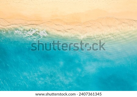 Relaxing aerial beach scene, summer vacation holiday. Blue waves surf crash amazing ocean lagoon sea sandy shore coastline. Tranquil aerial drone top view. Peaceful bright beachfront seaside landscape Royalty-Free Stock Photo #2407361345