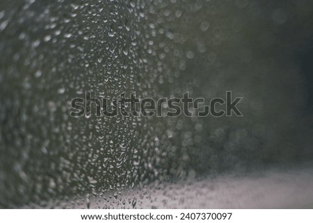 Macro picture of water drops. The after rain water effect on the window. 