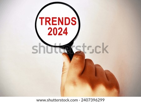 Magnifying Glass showing the word "Trends 2024"