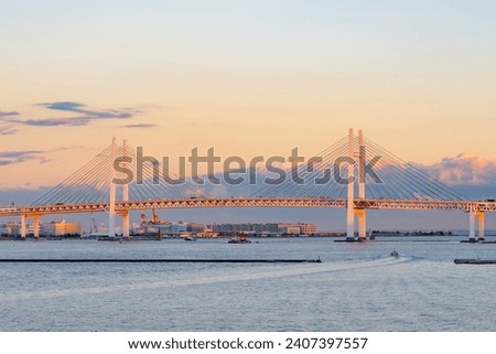 Evening view of Yokohama Bay Bridge seen from Oosanbashi in Yokohama City, Kanagawa Prefecture Royalty-Free Stock Photo #2407397557
