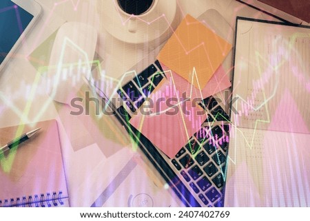 Multi exposure of financial chart drawing over table background with computer. Concept of research and analysis. Top view.