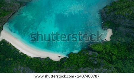 Aerial view with the tropical seashore island in a coral reef ,blue and turquoise sea Amazing nature landscape 