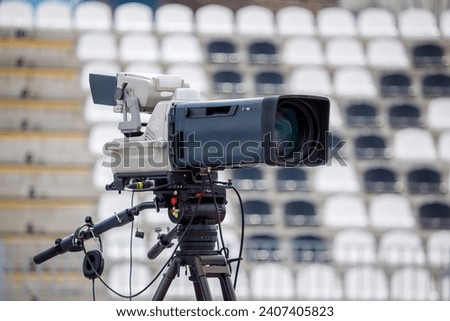 camera filming football at the stadium. High quality photo