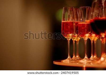 beautiful glasses of wine at an evening festive event.