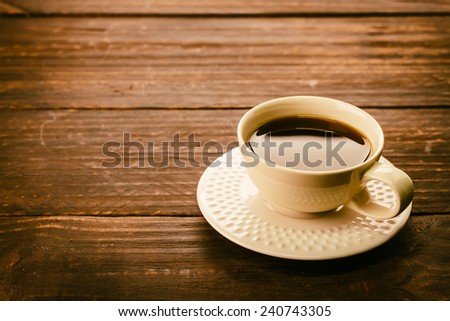 Coffee cup on wooden table - Vintage effect style pictures