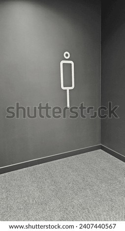 men's restroom symbol on the wall