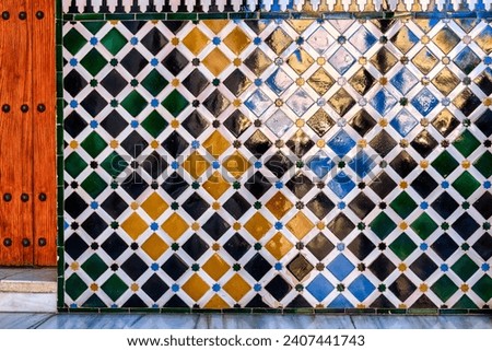 Front-view of a wall decorated with tiles in Alhambra, Spain