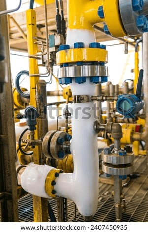 Pipes that have ice build up are caused by liquids inside the pipes or gas flowing, causing low temperatures to drop below zero. Royalty-Free Stock Photo #2407450935