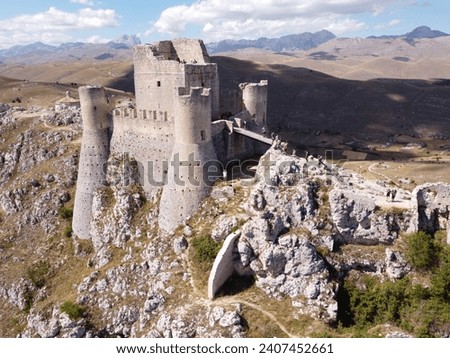 Rocca Calascio is an ancient medieval fortress in the mountains of Abruzzo, Italy, famous for being a filming location for the movie "Ladyhawke." Royalty-Free Stock Photo #2407452661
