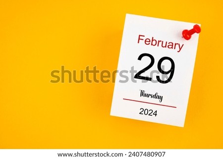 February 29th calendar for February 29 and wooden push pin on yellow background. Leap year, intercalary day, bissextile. Royalty-Free Stock Photo #2407480907