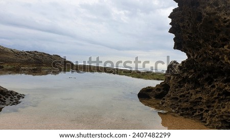 Coral rocks in the open sea provide exotic and natural beauty from the scenery around the beach. Taken 2 January 2024