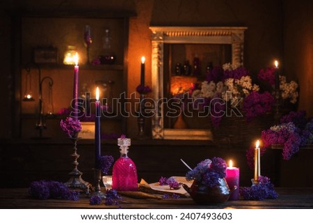 magic potion of lilac flowers in the witch's house Royalty-Free Stock Photo #2407493603