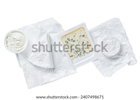 Variety of cheese kinds on kitchen table, brie, Camembert, Gorgonzola and blue creamy cheese. Isolated on white background, top view Royalty-Free Stock Photo #2407498671