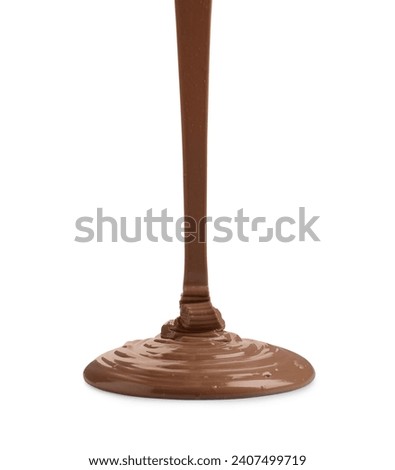 Pouring tasty melted milk chocolate isolated on white