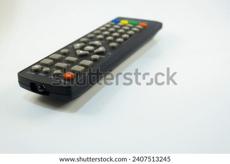 photo of tv remote with white background