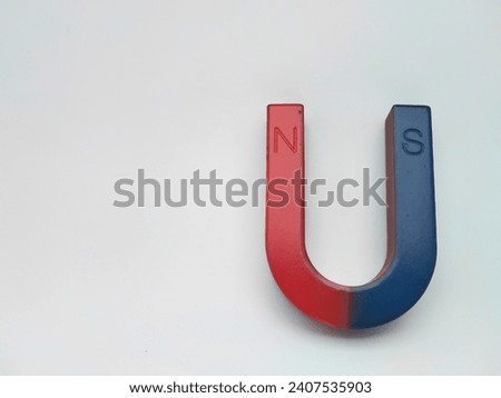 U-shaped magnetic bar on a light background