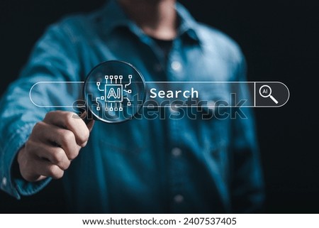 Ai tech concept, businessman use magnifying glass focus to AI search engine bar for data search optimization by artificial intelligence technology. 
