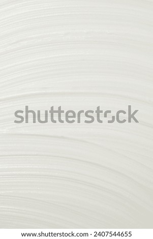 Thick white cosmetic cream applied to the surface. texture of the cream close-up. Royalty-Free Stock Photo #2407544655