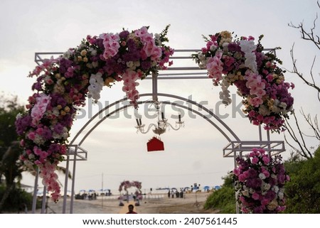 Wedding arch decorated with cloth and flowers outdoors. Beautiful wedding set up. Wedding ceremony in the garden. and in beaches. 