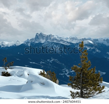 Beautiful winter mountain landscape. View from Rittner Horn (Italy) on  Puez Geislergruppe Royalty-Free Stock Photo #2407604451