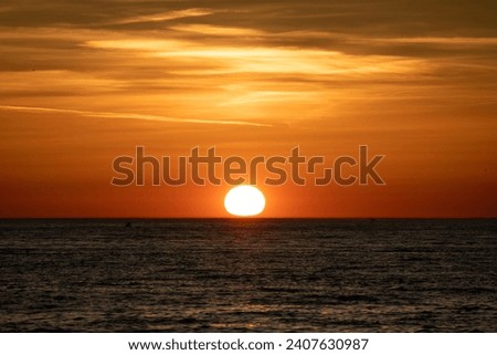 Beautiful golden hour sunset from Morske orgulje (Sea Organ) and Pozdrav suncu (The Greeting to the Sun), overlooking the Adriatic Sea from Zadar, Croatia. Royalty-Free Stock Photo #2407630987