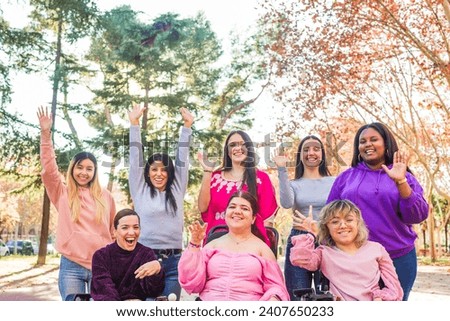 Greeting gesture, multiethnic group with disability cerebral palsy person. International womens day Royalty-Free Stock Photo #2407650233