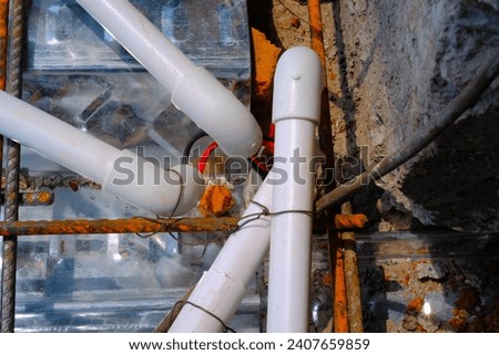 Industrial Photography. Construction work activities. Arranging the house's electrical wiring using pipes before covering them with cement castings. Bandung - Indonesia, Asia