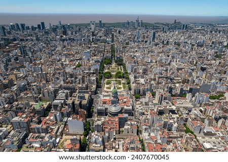 Beautiful aerial view of the Argentina flag waving, the Palace of the Argentine National Congress, in the city of Buenos Aires, Argentina