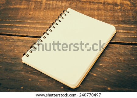 Note book on wooden background - Vintage effect style pictures