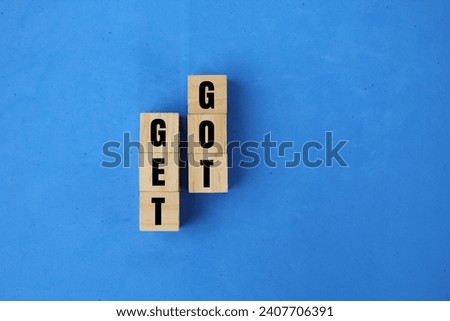 wooden cube with the words got and got. grammar concept. Get is the present tense form of the verb. Got is the past tense Royalty-Free Stock Photo #2407706391