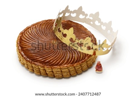galette des rois, French king cake isolated on a white background Royalty-Free Stock Photo #2407712487