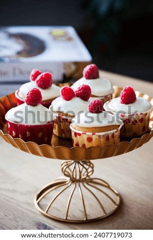 A beautiful Cupcakes, Cream, Raspberries image