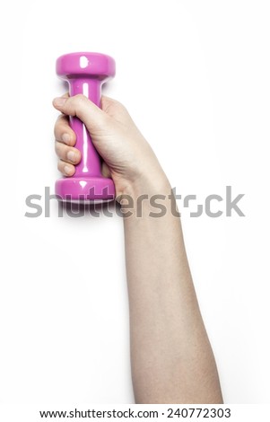 A female hand hold a dumbbells(green, pink) isolated white at the studio.