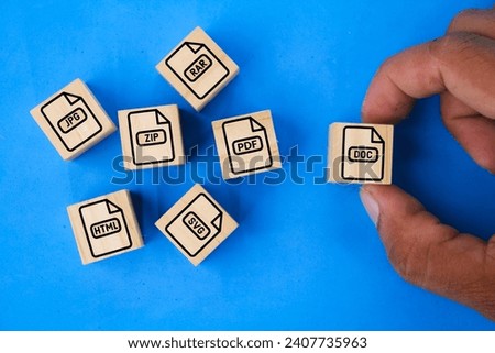 wooden with save file icon or download file format JPEG, ZIP, HTM, RAR, PDF And DOC file. files are saved into folders. Concept document management system or DMS. Highest Quality Image Format Royalty-Free Stock Photo #2407735963