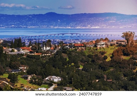 Residential neighborhood on the hills of San Francisco peninsula, Silicon Valley, San Mateo bridge in the background, California