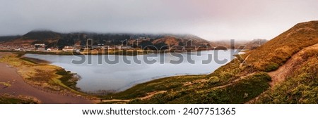 Rodeo Lagoon and Fort Cronkhite on the Pacific Ocean coastline, on a cloudy day, Marin Headlands, Marin County, California Royalty-Free Stock Photo #2407751365