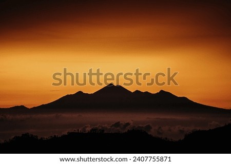 View of mountain with fog at sunset. High quality photo