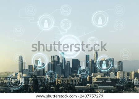 Double exposure of abstract virtual social network icons on Los Angeles city skyscrapers background. Marketing and promotion concept