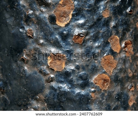 Black metal background with rust.
