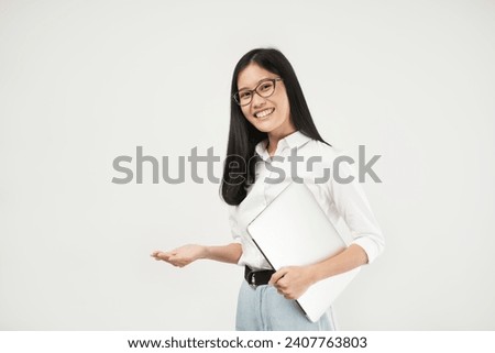 Photo of asian female successful entrepreneurs concept. Smiling professional businesswoman, real estate broker showing clients good deal, carry laptop in hand.