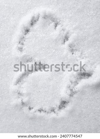 beauiful heart in the snow Royalty-Free Stock Photo #2407774547