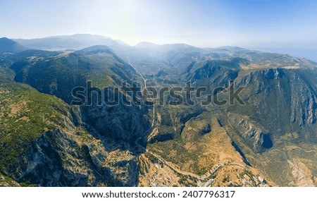 Delphi, Greece. Mountains in the Delphi Valley. Sunny weather, Summer morning. Aerial view