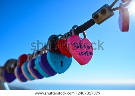 Love locks that embodies the couple's vow of love that cannot be broken forever, blue sky background