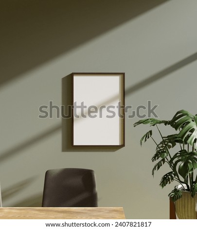 aesthetic frame mockup poster hanging on the green wall lit by beautiful light