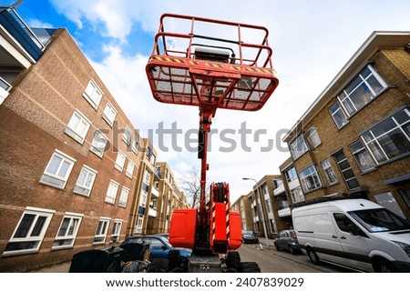 Aerial work platform, Elevating picker at europaen city street for urban infrastructure renovation Royalty-Free Stock Photo #2407839029