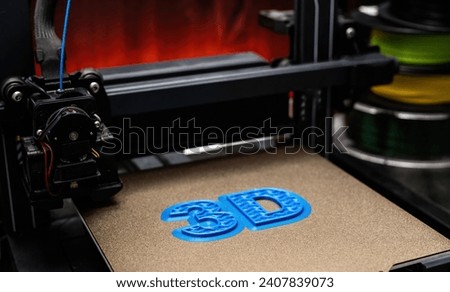 3D Printer Printing Process Of 3D Sign With Blue Color