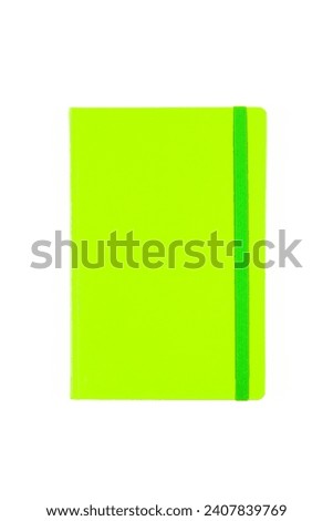Green closed blank paper notebook planner isolated on white background. Design template of copybook with elastic band for mockup. Top view.