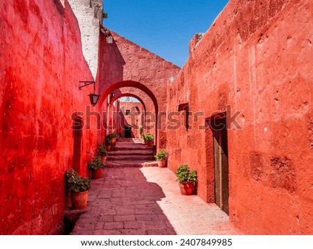 Stunning architectures of the ancient Santa Catalina monastery with bright red walls, Arequipa, Peru